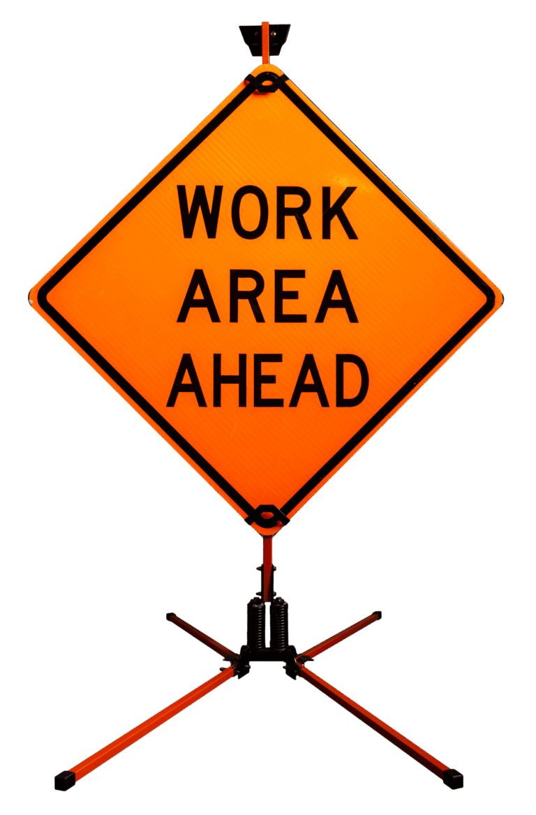 An orange diamond-shaped sign on a tripod stand reads WORK AREA AHEAD, indicating construction or maintenance activity ahead.