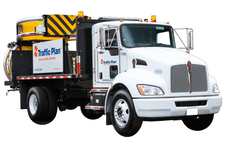 A white Traffic Plan truck equipped with a crash attenuator and arrow board, used for traffic control and road safety, is parked on a white background.