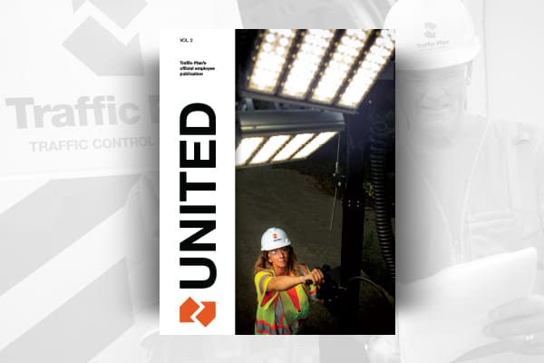 A woman in a hard hat and safety vest works with equipment under bright lights on the cover of a publication titled UNITED from Traffic Plans, Vol. 2.