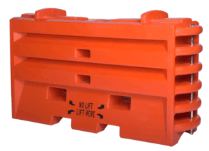 A large orange plastic barricade with grooves and handles, featuring the text NO LIFT with arrows and LIFT HERE at the bottom center, used for traffic control or safety barriers.
