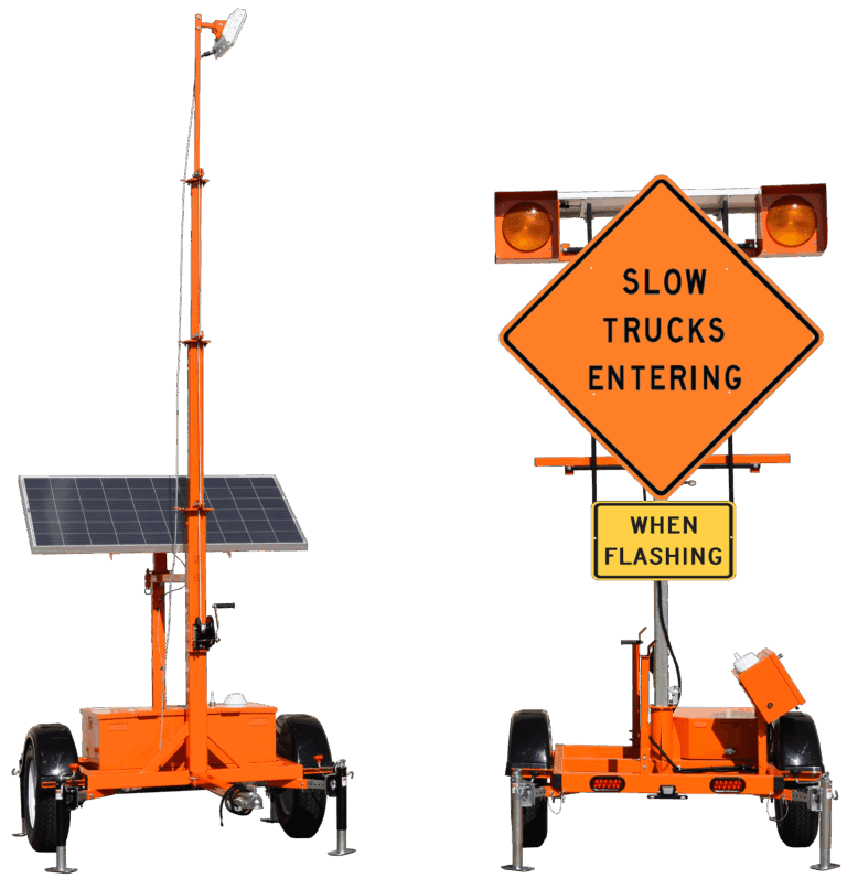 A portable orange traffic sign trailer with solar panels and lights displays Slow Trucks Entering and When Flashing. The sign is shown from the side and rear views.