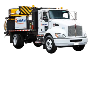 A white traffic control truck with “Traffic Plan” signage on the door and side, equipped with a mounted crash attenuator and arrow board on the back.